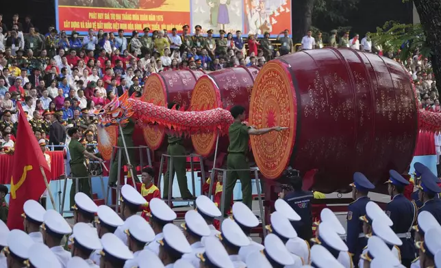 Dragon dances perform during a parade celebrating the 50th anniversary of the end of the Vietnam War in Ho Chi Minh City, Vietnam, Wednesday, April 30, 2025. (AP Photo/Achmad Ibrahim)