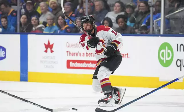 Ottawa Charge's Mannon McMahon (18) shoots against the Toronto Sceptres during the third period of a PWHL hockey game in Toronto, Saturday, May 3, 2025. (Arlyn McAdorey/The Canadian Press via AP)
