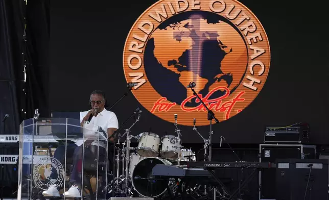 Pastor Curtis Farrar leads a prayer service at George Floyd Square on the five-year anniversary of Floyd's death, Sunday, May 25, 2025, in Minneapolis. (AP Photo/Abbie Parr)