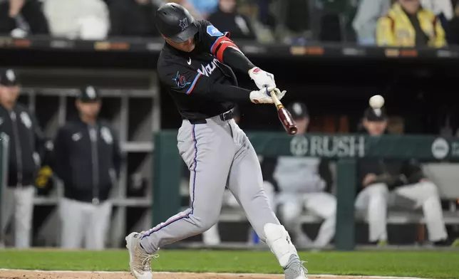 Miami Marlins' Eric Wagaman hits a two-run triple during the eighth inning of a baseball game against the Chicago White Sox, Saturday, May 10, 2025, in Chicago. (AP Photo/Erin Hooley)