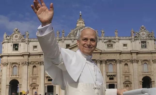 Pope Leo XIV on his popemobile tours St. Peter's Square at the Vatican prior to the inaugural Mass of his pontificate, Sunday, May 18, 2025. (AP Photo/Andrew Medichini)