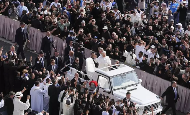 Pope Leo XIV on his popemobile tours St. Peter's Square at the Vatican prior to the inaugural Mass of his pontificate, Sunday, May 18, 2025. (AP Photo/Jacquelyn Martin, Pool)