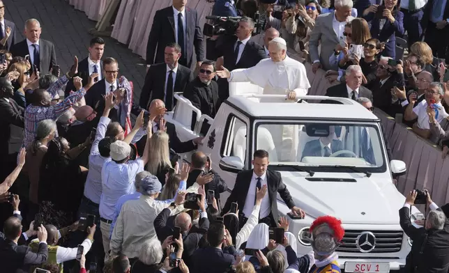 Pope Leo XIV on his popemobile tours St. Peter's Square at the Vatican prior to the inaugural Mass of his pontificate, Sunday, May 18, 2025. (AP Photo/Jacquelyn Martin, Pool)