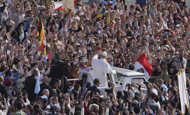 Pope Leo XIV on his popemobile tours St. Peter's Square at the Vatican prior to the inaugural Mass of his pontifcate, Sunday, May 18, 2025. (AP Photo/Jacquelyn Martin, Pool)