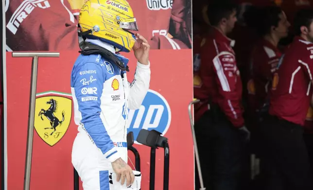 Ferrari driver Lewis Hamilton of Britain reacts after being eliminated during the qualifying session for the Formula One Miami Grand Prix auto race at the International Autodrome, Saturday, May 3, 2025, in Miami Gardens, Fla. (Shawn Thew/Pool Photo via AP)