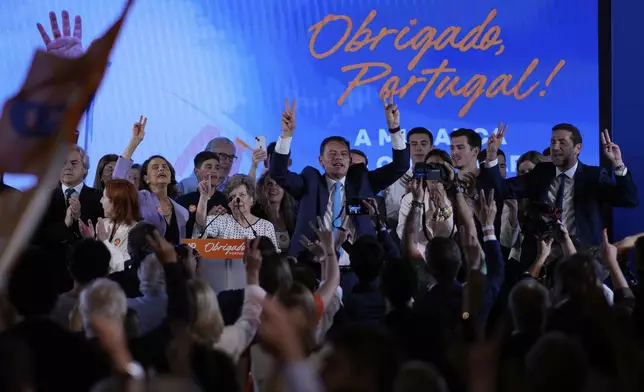 Incumbent Prime Minister and leader of the center-right Social Democratic Party Luis Montenegro reacts with his supporters, following Portugal's general election, in Lisbon, Monday, May 19, 2025. (AP Photo/Armando Franca)