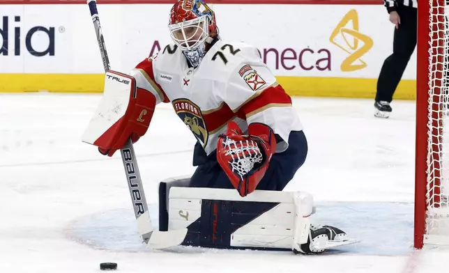 Florida Panthers goaltender Sergei Bobrovsky (72) blocks a shot of the Carolina Hurricanes during the second period of Game 2 of the NHL hockey Stanley Cup Eastern Conference finals in Raleigh, N.C., Thursday, May 22, 2025. (AP Photo/Karl DeBlaker)