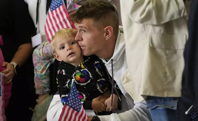 Afrikaner refugees from South Africa arrive, Monday, May 12, 2025, at Dulles International Airport in Dulles, Va. (AP Photo/Julia Demaree Nikhinson)