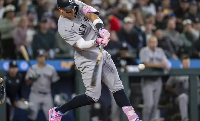 New York Yankees' Aaron Judge hits a solo home run during the eighth inning of a baseball game against the Seattle Mariners, Wednesday, May 14, 2025, in Seattle. (AP Photo/Stephen Brashear)