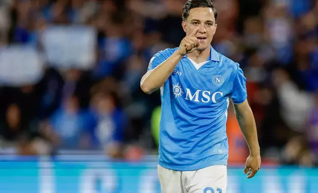 Napoli's Giacomo Raspadori celebrates after scoring a goal during the Serie A soccer match between Napoli and Genoa at the Diego Armando Maradona Stadium in Naples, Italy, Sunday, May 11, 2025. (Alessandro Garofalo/LaPresse via AP)
