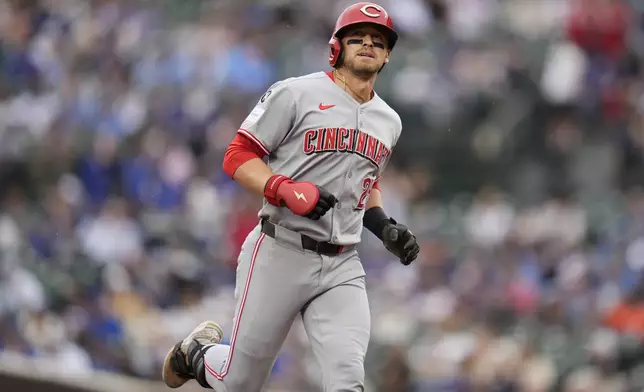 Cincinnati Reds' TJ Friedl (29) runs the bases after hitting a home run during the first inning of a baseball game against the Chicago Cubs, Friday, May 30, 2025, in Chicago. (AP Photo/Erin Hooley)