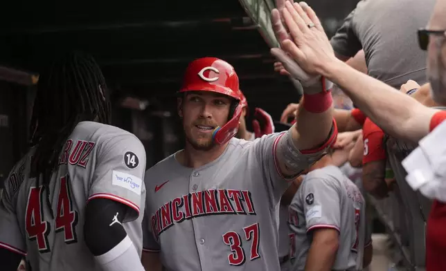 Cincinnati Reds' Tyler Stephenson (37) celebrates in the dugout after hitting a two-run home run during the fourth inning of a baseball game against the Chicago Cubs, Friday, May 30, 2025, in Chicago. (AP Photo/Erin Hooley)