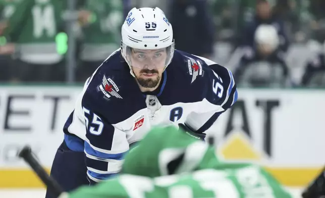 Winnipeg Jets center Mark Scheifele waits on a face-off against the Dallas Stars in the second period of Game 6 of a second-round NHL hockey playoff series in Dallas, Saturday, May 17, 2025. (AP Photo/Gareth Patterson)