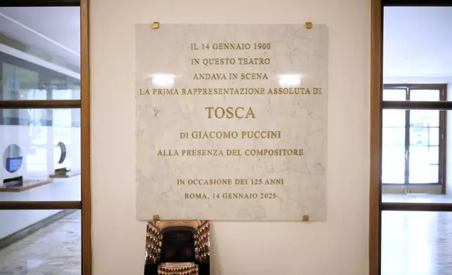 A plate celebrates the 125th anniversary of the first ever performance of Giacomo Puccini's "Tosca" opera in the foyer of the "Teatro dell' Opera" opera house, in Rome, Thursday, April 10, 2025. (AP Photo/Andrew Medichini)