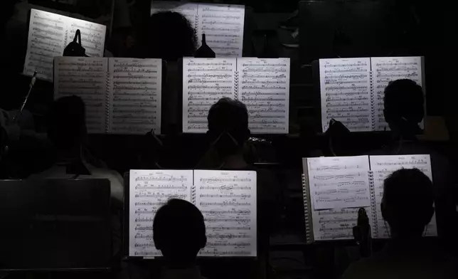 Musicians of the "Teatro dell' Opera" opera house orchestra practice in Rome, Thursday, April 10, 2025. (AP Photo/Andrew Medichini)