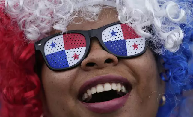 A woman protests the Panamanian government's decision to sign an agreement with the United States that demonstrators deem at odds with their sovereignty, in Panama City, Tuesday, April 29, 2025. (AP Photo/Matias Delacroix)