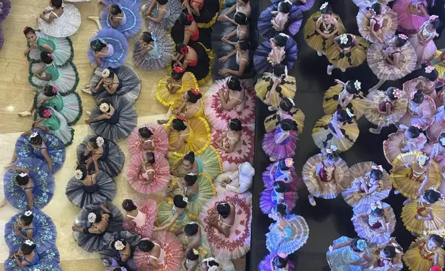 Indonesian ballet students gather during competition at shopping mall in Bekasi, on the outskirt of Jakarta, Sunday, April, 27, 2025. (AP Photo/Achmad Ibrahim)