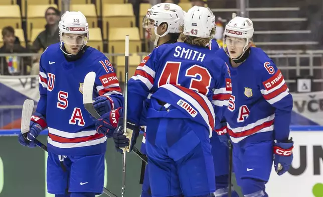 USA's forward Cutter Gauthier, left, celebrates his goal with his teammates, during the IIHF 2025 World Championship preliminary round group B game between USA and Hungary, at the Jyske Bank Boxen, in Herning, Denmark, Sunday, May 11, 2025. (Salvatore Di Nolfi/Keystone via AP)