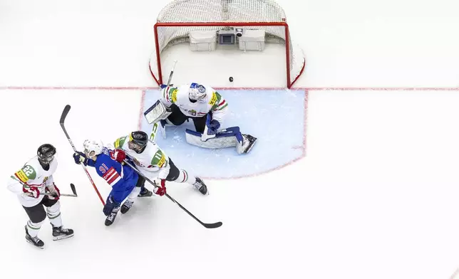 USA's forward Frank Nazar, second left, scores his side's fourth goal during the IIHF Ice Hockey World Championship group B match between USA and Hungary in Herning, Denmark, Sunday, May 11, 2025. (Salvatore Di Nolfi/Keystone via AP)