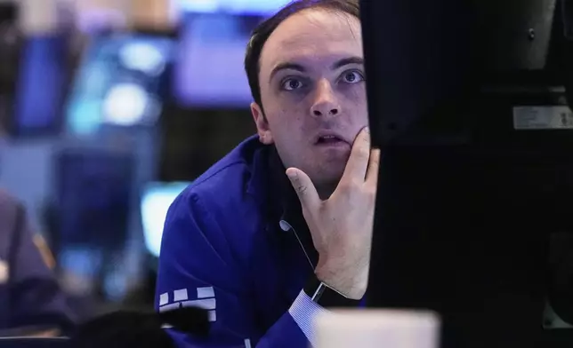Specialist Joseph Maguire works at his post on the floor of the New York Stock Exchange, Tuesday, May 20, 2025. (AP Photo/Richard Drew)
