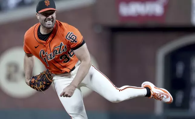 San Francisco Giants pitcher Robbie Ray throws against the Colorado Rockies during the fourth inning of a baseball game in San Francisco, Friday, May 2, 2025. (AP Photo/Jed Jacobsohn)