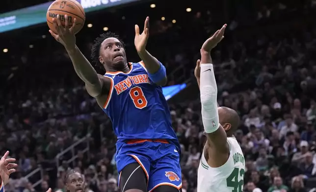 New York Knicks forward OG Anunoby (8) drives to the basket against Boston Celtics center Al Horford (42) during the first half of Game 1 of an NBA basketball second-round playoff series Monday, May 5, 2025, in Boston. (AP Photo/Charles Krupa)