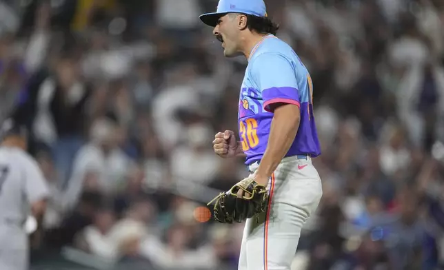 Colorado Rockies relief pitcher Zach Agnos reacts after retiring New York Yankees' Austin Wells to end a baseball game Friday, May 23, 2025, in Denver. (AP Photo/David Zalubowski)