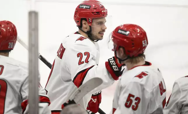 Carolina Hurricanes center Logan Stankoven (22) celebrates his goal in the third period of Game 1 of a second-round NHL hockey playoff series against the Washington Capitals Tuesday, May 6, 2025, in Washington. (AP Photo/Nick Wass)