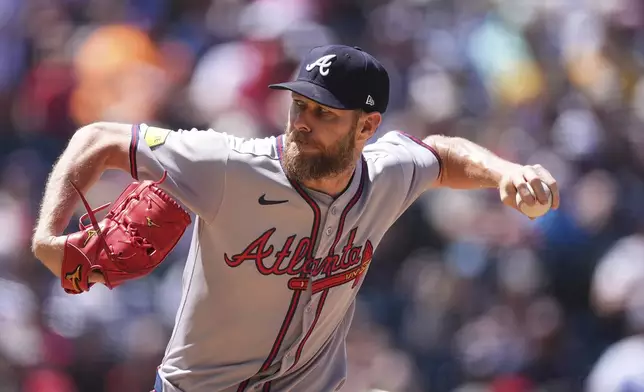 Atlanta Braves starting pitcher Chris Sale works against the Colorado Rockies in the fifth inning of a baseball game Wednesday, April 30, 2025, in Denver. (AP Photo/David Zalubowski)