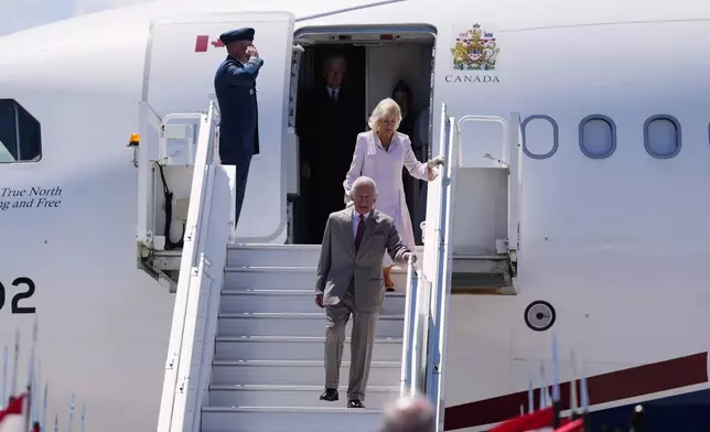 King Charles and Queen Camilla arrive at the Ottawa International Airport in Ottawa, Canada, for a royal visit, on Monday, May 26, 2025. (Justin Tang/The Canadian Press via AP)