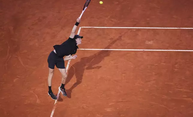 Italy's Jannik Sinner serves against Argentina's Mariano Navone during a second round match at the Italian Open tennis tournament in Rome, Saturday, May 10, 2025. (AP Photo/Andrew Medichini)