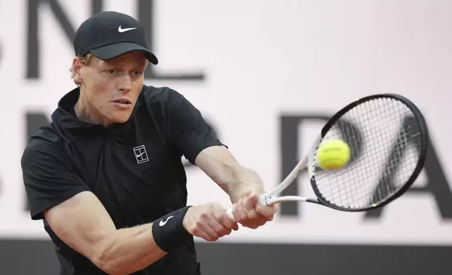 Italy's Jannik Sinner returns to Argentina's Mariano Navone during their second round match at the Italian Open tennis tournament in Rome, Saturday, May 10, 2025. (AP Photo/Andrew Medichini)