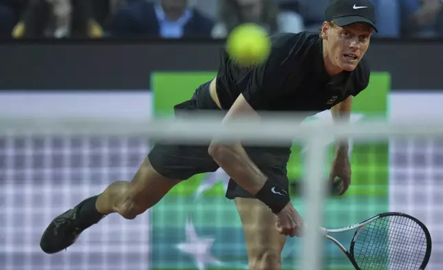 Italy's Jannik Sinner watches her serve against Argentina's Mariano Navone during a second round match at the Italian Open tennis tournament in Rome, Saturday, May 10, 2025. (AP Photo/Andrew Medichini)