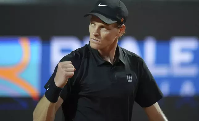 Italy's Jannik Sinner reacts after scoring a point against Argentina's Mariano Navone during a second round match at the Italian Open tennis tournament in Rome, Saturday, May 10, 2025. (AP Photo/Andrew Medichini)