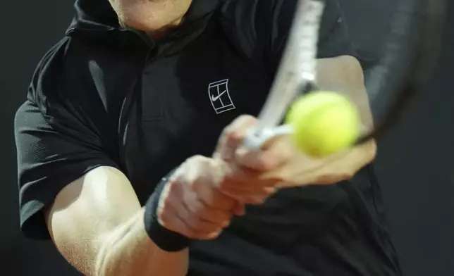 Italy's Jannik Sinner hits a return shot against Argentina's Mariano Navone during a second round match at the Italian Open tennis tournament in Rome, Saturday, May 10, 2025. (AP Photo/Andrew Medichini)