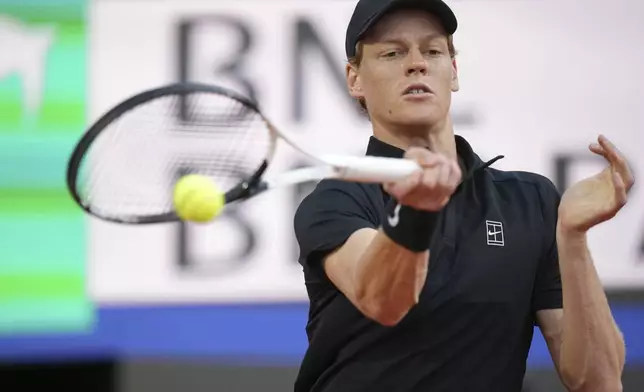 Italy's Jannik Sinner hits a return shot against Argentina's Mariano Navone during their second round match at the Italian Open tennis tournament in Rome, Saturday, May 10, 2025. (AP Photo/Andrew Medichini)