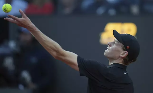 Italy's Jannik Sinner serves against Argentina's Mariano Navone during a second round match at the Italian Open tennis tournament in Rome, Saturday, May 10, 2025. (AP Photo/Andrew Medichini)