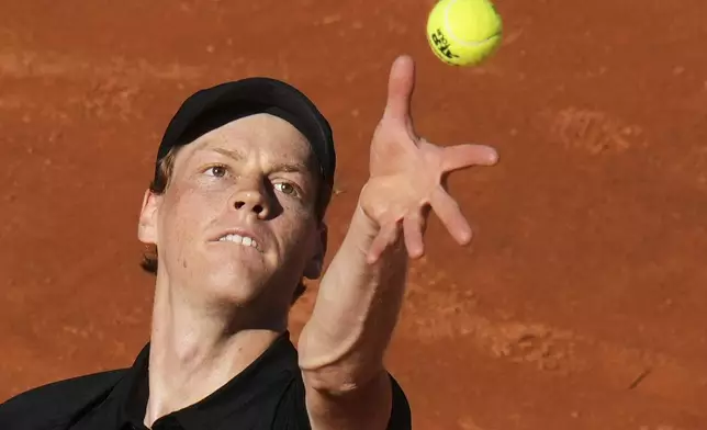 Italy's Jannik Sinner serves the ball to Netherlands' Jesper De Jong during their tennis match at the Italian Open at the Foro Italico, in Rome, Monday, May 12, 2025. (AP Photo/Alessandra Tarantino)