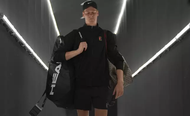 Italy's Jannik Sinner looks down upon his arrival for the second round match against Argentina's Mariano Navone, at the Italian Open tennis tournament in Rome, Saturday, May 10, 2025. (AP Photo/Andrew Medichini)