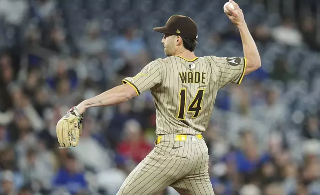 San Diego Padres outfielder Tyler Wade (14) pitches against the Toronto Blue Jays during the eighth inning of a baseball game in Toronto on Wednesday, May 21, 2025. (Nathan Denette/The Canadian Press via AP)