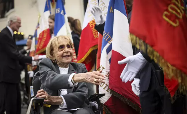 Holocaust survivor Arlette Testyler attends the ceremony to mark the 80th anniversary of the return of the deportees, in Paris, France, Sunday, April 27, 2025. (AP Photo/Thomas Padilla)