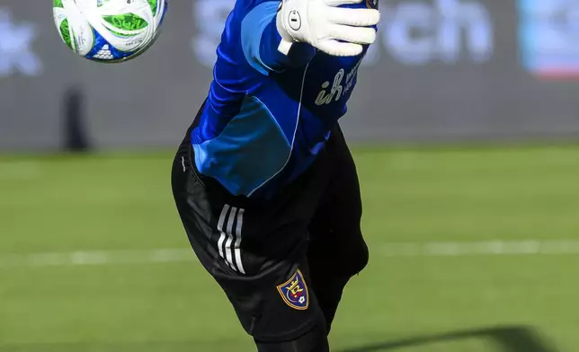 Real Salt Lake goalkeeper Rafael Cabral (1) reaches to block the ball during warm-ups ahead an MLS soccer game against the Vancouver Whitecaps, Saturday, May 24, 2025, in Sandy, Utah. (AP Photo/Tyler Tate)