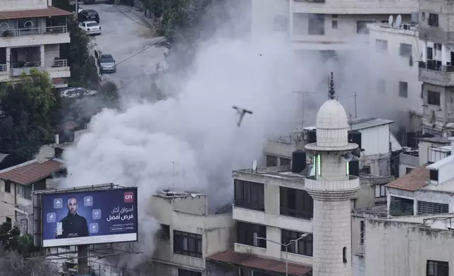 Smoke rises as the Israeli forces demolish the home of Jaafar Mona, a Palestinian militant who died when the bomb he was carrying in Tel Aviv exploded, apparently prematurely, last August. In the West Bank City of Nablus on Thursday, May 29, 2025. (AP Photo/Majdi Mohammed)