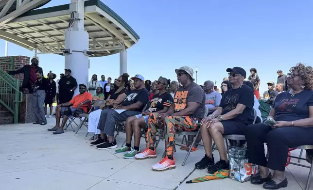 Students and alumni of Florida AM University listen to speakers at a campus rally in Tallahassee, Fla., Wednesday, May 14, 2025, protesting the naming of an ally of Republican Gov. Ron DeSantis as one of the finalists to be FAMU's next president. (AP Photo/Kate Payne)