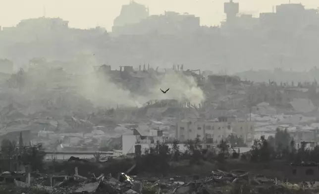 Buildings that were destroyed during the Israeli ground and air operations in the Gaza Strip are seen from southern Israel on Sunday, May 4, 2025. (AP Photo/Ariel Schalit)