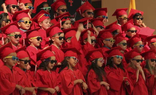 Kindergartners perform during their graduation during a ceremony at the Loving Elementary School in Loving, New Mexico, on Tuesday, May 20, 2025. (AP Photo/Susan Montoya Bryan)