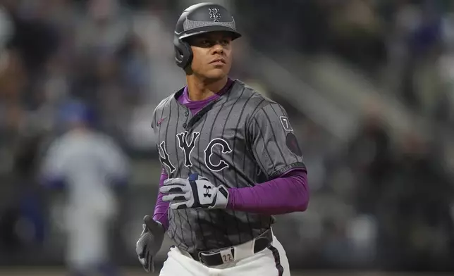 New York Mets' Juan Soto reacts after the fourth inning of a baseball game against the Los Angeles Dodgers Saturday, May 24, 2025, in New York. (AP Photo/Frank Franklin II)