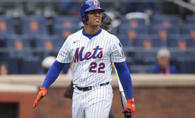 New York Mets' Juan Soto (22) reacts after striking out during the fifth inning of a baseball game against the Chicago White Sox Wednesday, May 28, 2025, in New York. (AP Photo/Frank Franklin II)