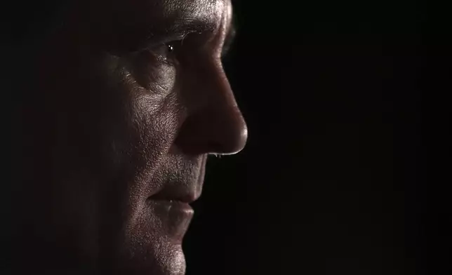 Presidential candidate Nicusor Dan speaks to media after polls closed in the first round of the country's presidential election redo in Bucharest, Romania, Sunday, May 4, 2025. (AP Photo/Eduard Vinatoru)