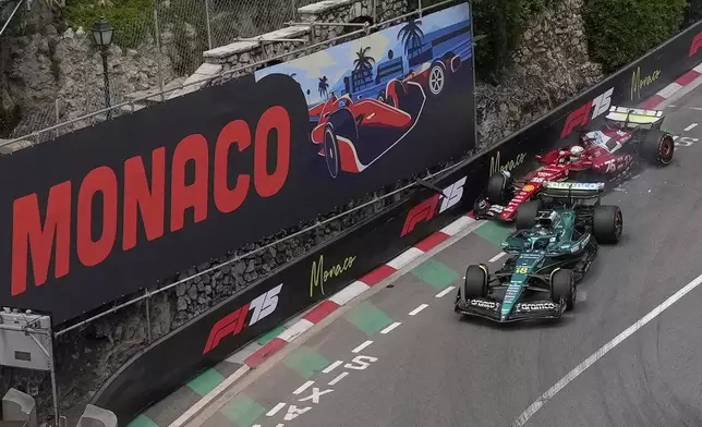 Ferrari driver Charles Leclerc of Monaco crashes with Aston Martin driver Lance Stroll of Canada during the first free practice ahead of the Formula One Monaco Grand Prix race at the Monaco racetrack in Monaco, Friday, May 23, 2025. (AP Photo/Manu Fernandez)